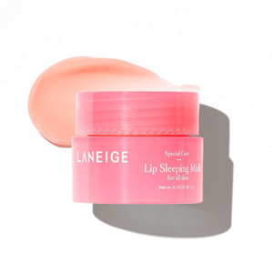 Pink lip balm container with a swatch of pink color on a white background